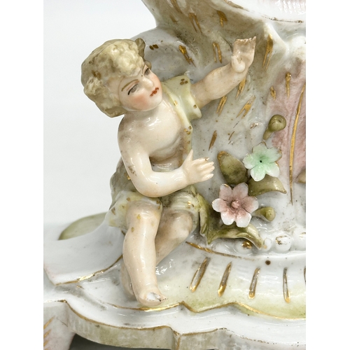 39 - Sitzendorf Porcelain. A Late 19th Century figural mantle clock. Circa 1880-1900. 14x10x20cm