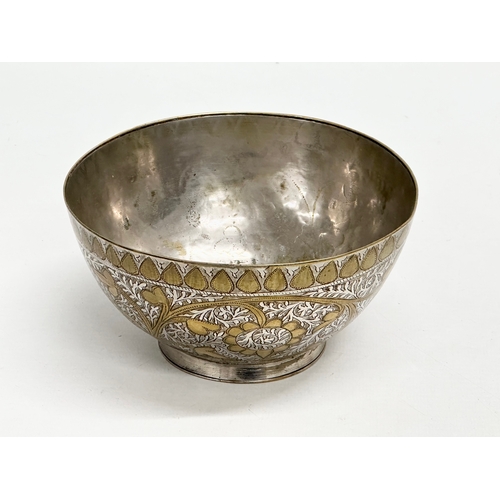 296 - A 19th Century Middle Eastern engraved brass and silver overlay bowl. 14x7cm