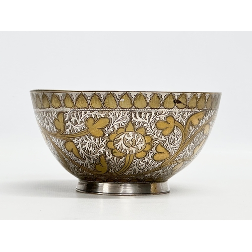 296 - A 19th Century Middle Eastern engraved brass and silver overlay bowl. 14x7cm