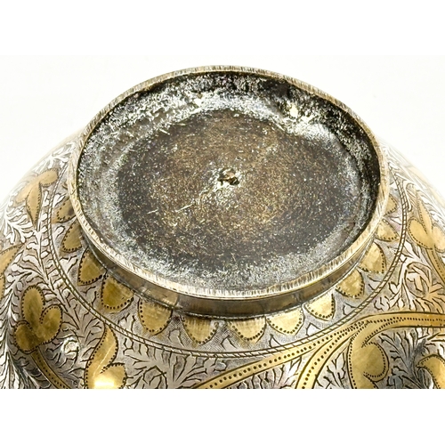 296 - A 19th Century Middle Eastern engraved brass and silver overlay bowl. 14x7cm