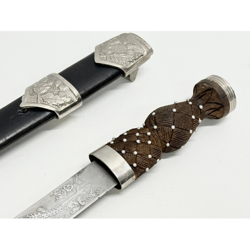 511 - A pair of Scottish Dirk knives. 47cm