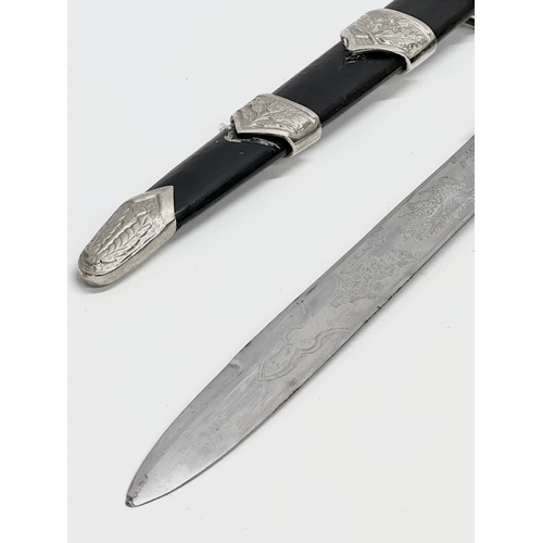 511 - A pair of Scottish Dirk knives. 47cm