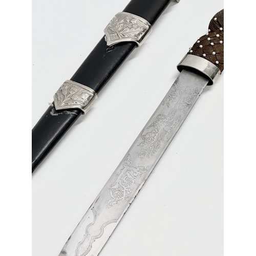 511 - A pair of Scottish Dirk knives. 47cm