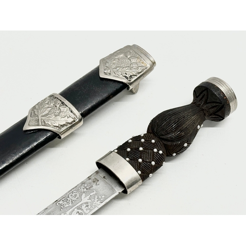 511 - A pair of Scottish Dirk knives. 47cm