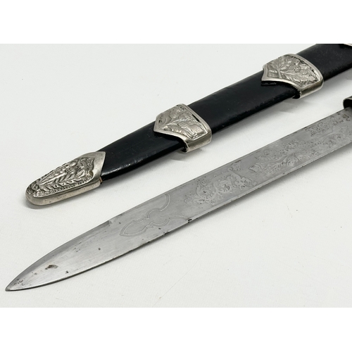 511 - A pair of Scottish Dirk knives. 47cm