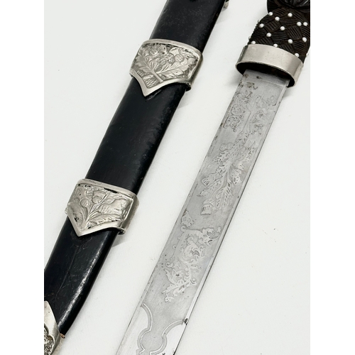 511 - A pair of Scottish Dirk knives. 47cm