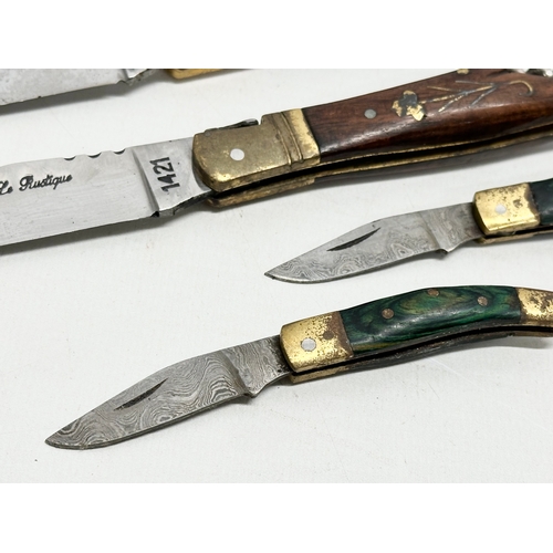 512 - 2 pairs of pocket knives. A pair of Laguiole pocket knives and a pair of miniature Damascus pocket k... 