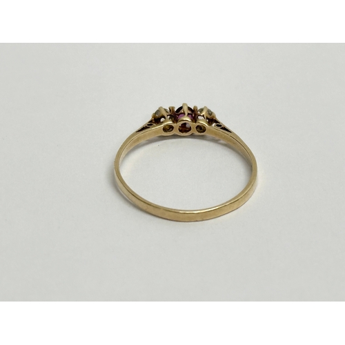 654 - A ladies 14ct gold and diamond ring. Stamped 585. 0.97 grams. Size L/M.     (11)