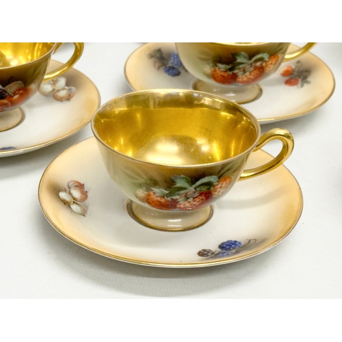 286 - A 15 piece Mid 20th Century gilt fruit pattern coffee service.