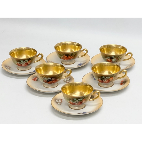 286 - A 15 piece Mid 20th Century gilt fruit pattern coffee service.