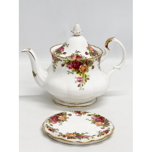 441 - A Royal Albert “Old Country Roses” teapot with stand. 25x19cm