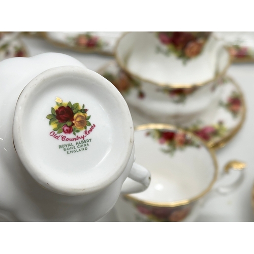 445 - A 21 piece Royal Albert “Old Country Roses” tea service. 2 cake plates, sandwich tray, 3 sandwich pl... 