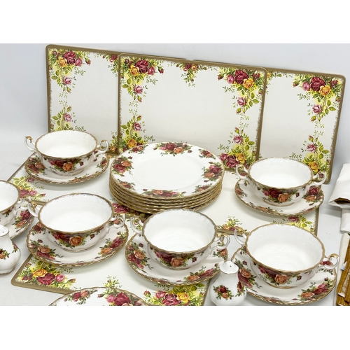 447 - A 31 piece Royal Albert “Old Country Roses” part dinner service. 6 soup bowls, 6 saucers, 3 sandwich... 