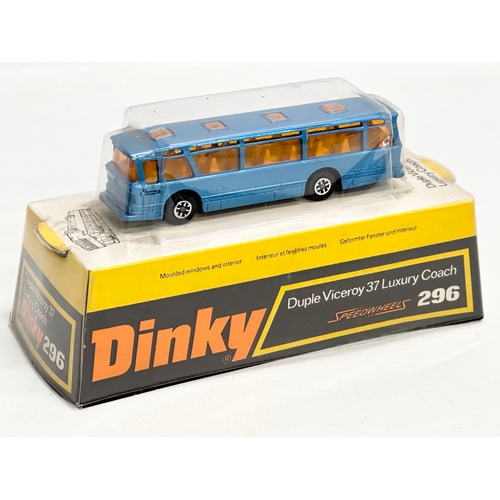 754 - 2 vintage Dinky buses. An unopened Swiss PTT Bus. A Duple Viceroy 37 Luxury Coach.