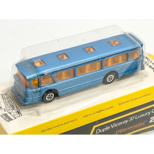 754 - 2 vintage Dinky buses. An unopened Swiss PTT Bus. A Duple Viceroy 37 Luxury Coach.