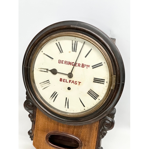 45 - Beringer Bros, Belfast. A Late 19th Century mahogany advertising wall clock. Key and pendulum. 33x47... 