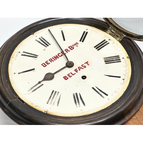 45 - Beringer Bros, Belfast. A Late 19th Century mahogany advertising wall clock. Key and pendulum. 33x47... 