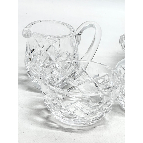 528 - Waterford Crystal. A small honey pot, 2 sets of milk jugs and sugar bowls, bulbous vase.