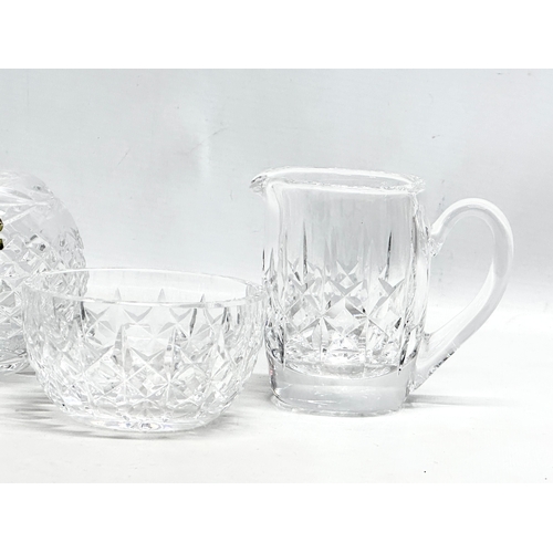 528 - Waterford Crystal. A small honey pot, 2 sets of milk jugs and sugar bowls, bulbous vase.