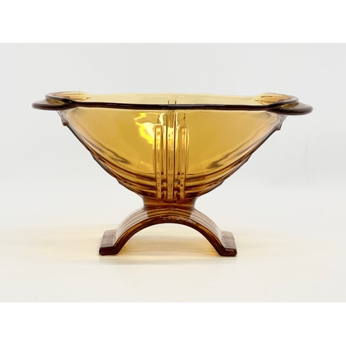 565 - A 1930’s Art Deco Czech amber glass bowl. By Stolzle. 25x21.5x13cm.