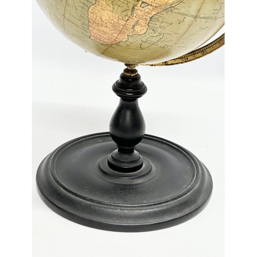 41 - An Early 20th Century Philips 9 inch Terrestrial Globe on ebonised base. George Philips & Son. 42cm.