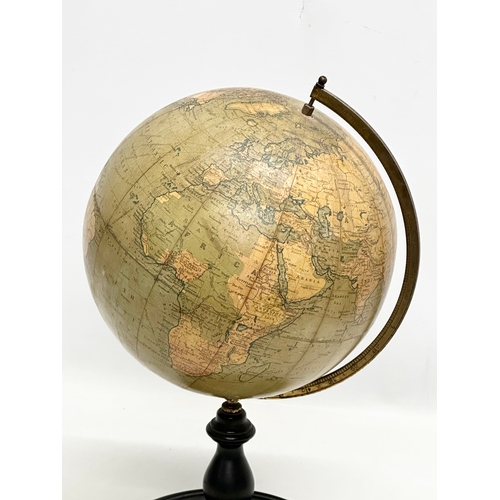 41 - An Early 20th Century Philips 9 inch Terrestrial Globe on ebonised base. George Philips & Son. 42cm.