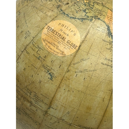 41 - An Early 20th Century Philips 9 inch Terrestrial Globe on ebonised base. George Philips & Son. 42cm.