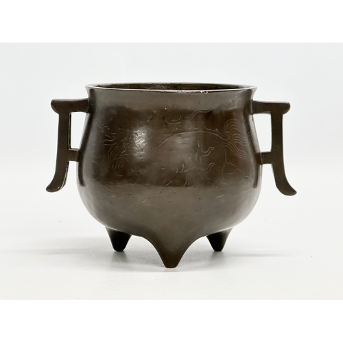 13 - An 18th Century Qing Dynasty bronze tripod censer. 14x10x10cm