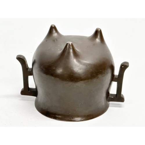 13 - An 18th Century Qing Dynasty bronze tripod censer. 14x10x10cm