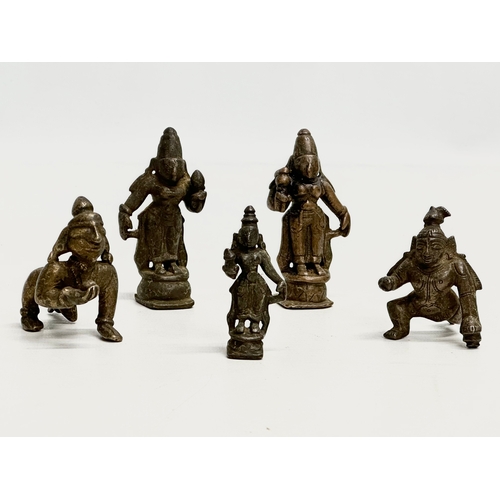 243 - A collection of 19th and 20th Century Tibetan bronze miniatures and brass bell.