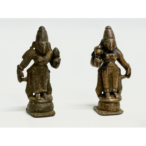 243 - A collection of 19th and 20th Century Tibetan bronze miniatures and brass bell.