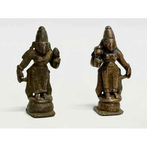 243 - A collection of 19th and 20th Century Tibetan bronze miniatures and brass bell.