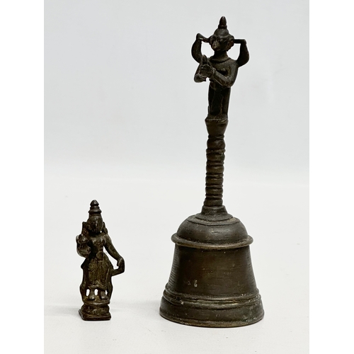 243 - A collection of 19th and 20th Century Tibetan bronze miniatures and brass bell.