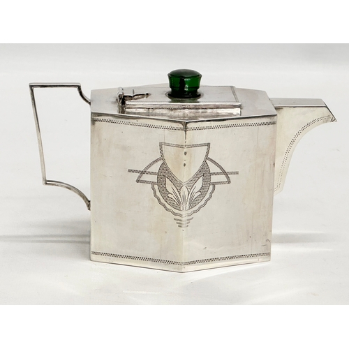 109 - A fine quality Early 20th Century Art Deco silver plated teapot. 17x9x11cm.