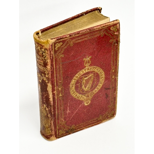 411 - A miniature 19th Century Century book on The Irish Melodies by Thomas Moore. 6x9cm (2)