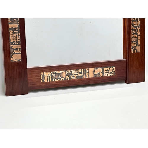 340 - Pedersen & Hansen. A Danish Mid Century rosewood and copper framed mirror. 60x110cm