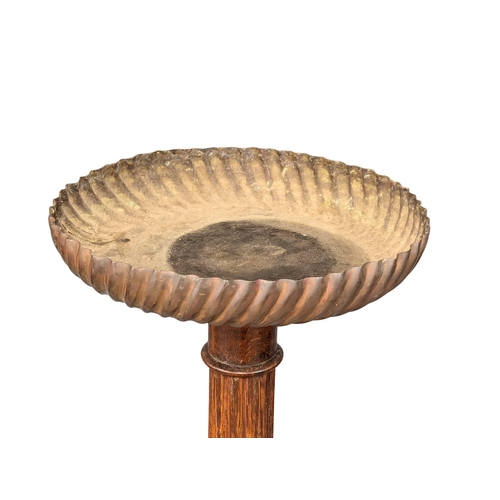 352 - A pair of large good quantity Late 19th Century oak torcheres with copper base and tops and reeded c... 