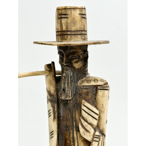 294 - A tall Late 19th/Early 20th Century Chinese carved bone water carrier sculpture. 33cm