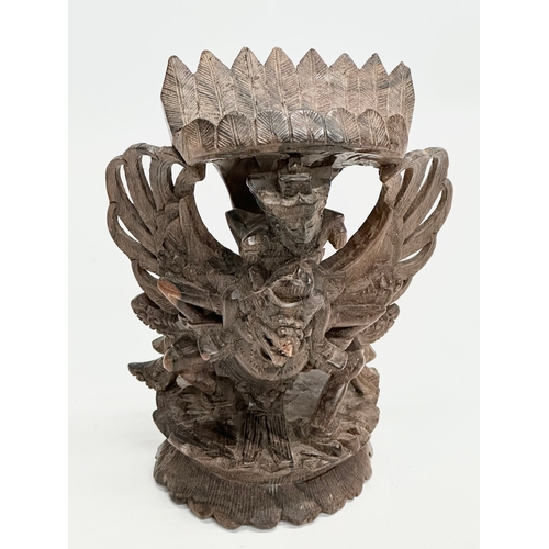 293 - An Early 20th Century carved Vishnu and Garuda statue. 18cm