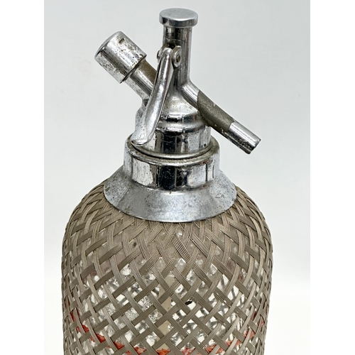 821 - A vintage soda syphon. 34cm