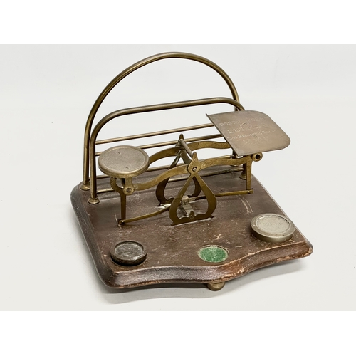 822 - 2 Late 19th Century postal scales. A postal scale with letter rack 21x20x18cm