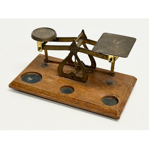 822 - 2 Late 19th Century postal scales. A postal scale with letter rack 21x20x18cm