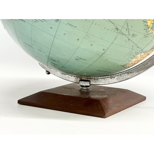 354 - A large 1960’s Philips Challenge Globe on teak base. 36x42cm