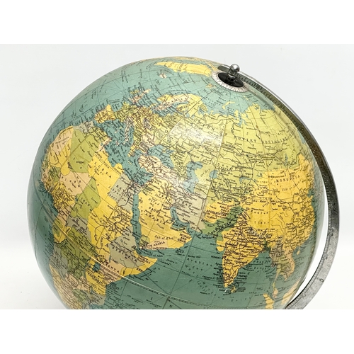 354 - A large 1960’s Philips Challenge Globe on teak base. 36x42cm