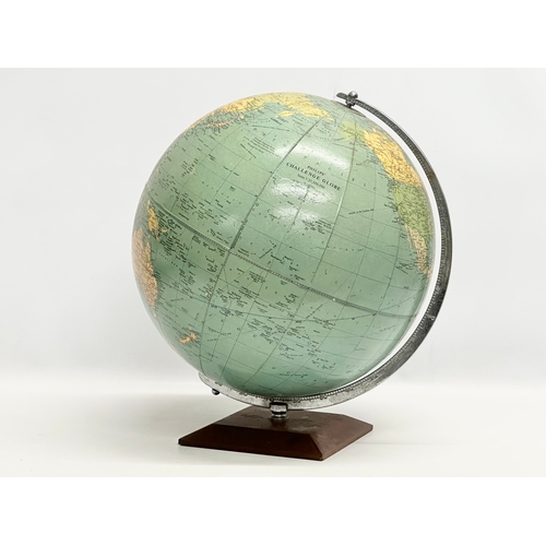 354 - A large 1960’s Philips Challenge Globe on teak base. 36x42cm