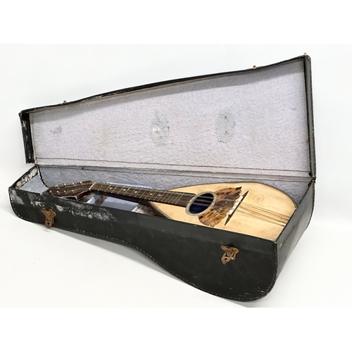 790 - Giuseppe Puglisi Reale & Figli. An Early 20th Century mandolin with case.