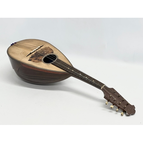 790 - Giuseppe Puglisi Reale & Figli. An Early 20th Century mandolin with case.