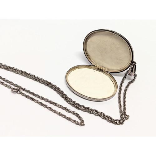 693A - An early 20th century silver locket & chain, stamped Chester MG & Co. 40.5 grams. Locket measures 4x... 