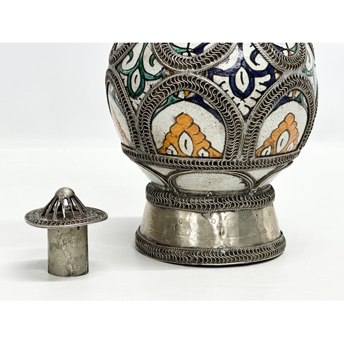 309A - A large signed Moroccan pewter bound pot with cover. 36cm