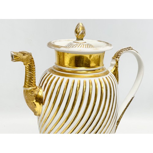 9 - Paris Porcelain. A large Early 19th Century French Empire gilt coffee pot. Circa 1810-1830. 23x28cm.... 